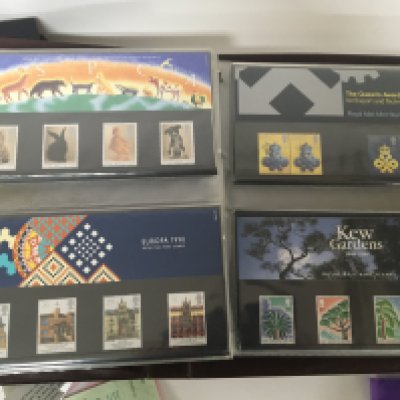 Four albums containing Presentation Packs Elizabeth II Pictorial unused stamps including an album of Queen Elizabeth II stamps mainly unused. (4)