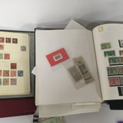 A collection of seven stamp albums containing Victorian stamps including British Empire and colonial and other world stamps including some unused stamps an album containing unused Elizabeth II stamps.