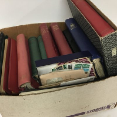 A box containing twelve albums of stamps including used Victorian Empire and Commonwealth stamps and later stamps including world stamps most are used stamps a mixed lot.