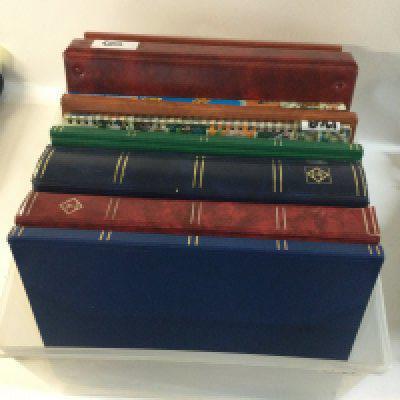 A box containing 14 albums of mainly Queen Elizabeth II stamps.