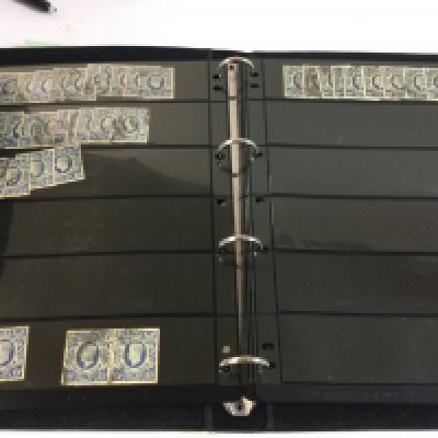 An album of high value George V and George VI stamps.