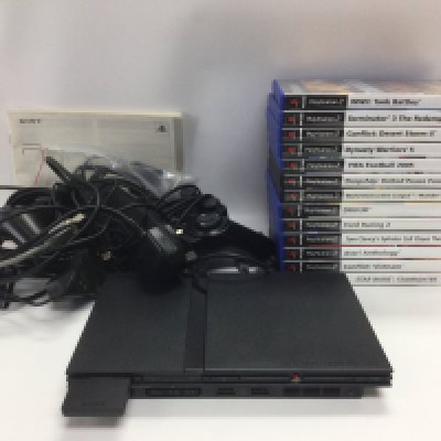 A Sony Playstation 2 and games, a boxed Saitek Kasparov chess trainer and a Sinclair ZX81 plus booklets. Shipping category D.