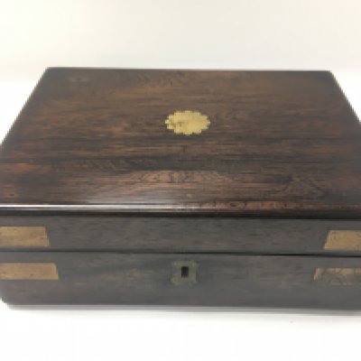 An unusual rosewood writing top and brass bound box. Approximately 24cm wide and 18cm deep. Postage B