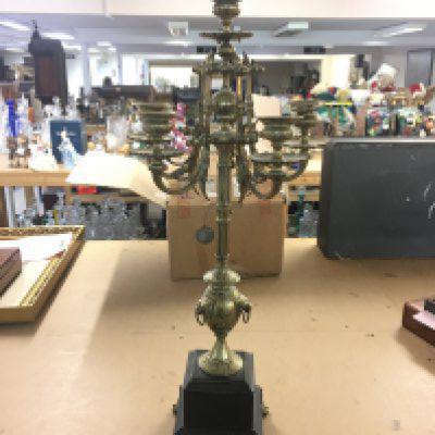 A brass candelabra with five branches and a central one. 67cm tall 27cm wide.