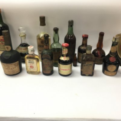 A collection of various vintage bottles of spirits including brandy rum gin etc. Postage D