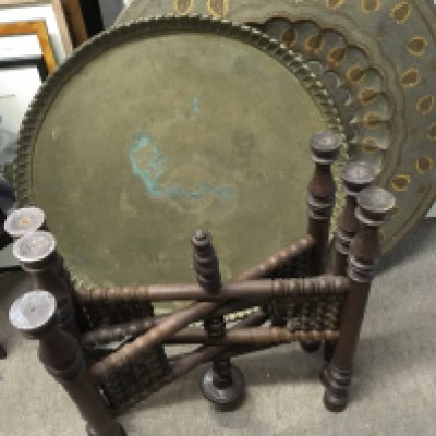 Two early 20th century Middle Eastern brass top tables with a folding base. NO RESERVE