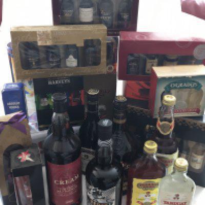 A box collection of bottles of Rum 1l and 70cl presentation boxes of small bottles of Port and other spirits including Vodka.- NO RESERVE