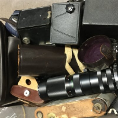 A collection of vintage cameras including an Asahi Pentax Spotmatic, Canon EOS 630, Vivitar Tele-Zoom 90-230mm lens, box cameras including Brownie Junior six 20, Coronet F-20, Kodak Brownie Model I. This lot cannot be posted