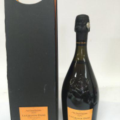 A Vintage bottle of La Grande Dame Veuve Clicquot Ponsardin Champagne in a fitted box.