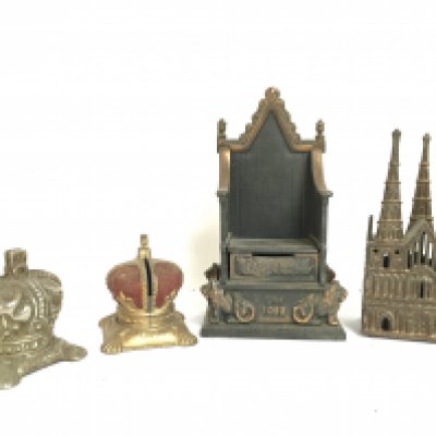 A collection of interesting money boxes including Coronation crowns, Lichfield cathedral and a cast iron Coronation throne by Harper. Postage category C