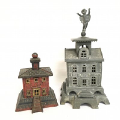 Cast iron money box buildings, a bank and a French Family Fund building. 18 and 32cm tall. Postage category C