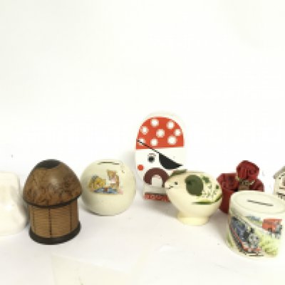 A collection of money boxes mostly porcelain examples. This lot cannot be posted