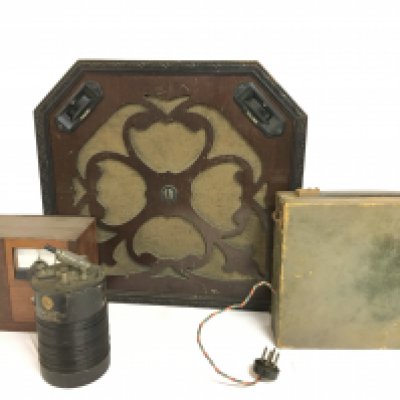 A collection of vintage radios including The Brownie Crystal Wireless Receiver and a Umello radio.