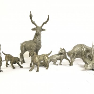 A collection of silvered metal animal figure ornaments including fighting cocks, a deer (30cm tall), bull etc. Postage category C