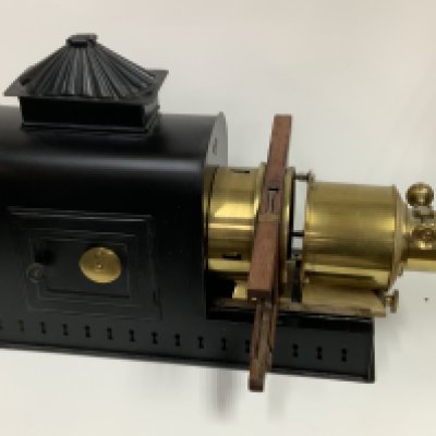 A vintage magic lantern with a small collection of advertising Bovril slides. (D)