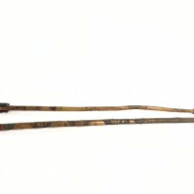 Two bamboo walking sticks, one Chinese with carvings of faces and a root ball handle, the other stick an African tribal art example with a ebony figure handle . 82 and 88cm long. This lot cannot be posted