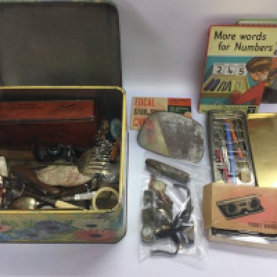 A tin of mixed items including watches, pocket knives, cutlery etc. Shipping category D.