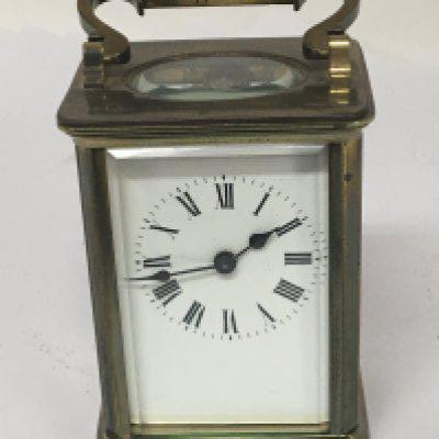 A brass cased carriage CVL with key and seen working. NO RESERVE