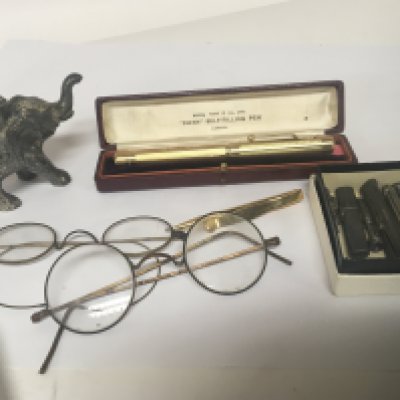 DUPLICATE LOT -  A cased Swan fountain pen a similar pencil an elephant table lighter and silver pencils and oddments.