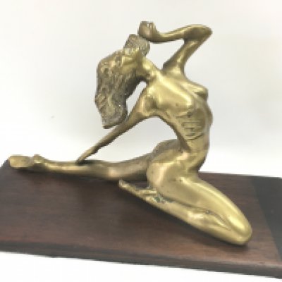 A 20th century bronze figure of a nude lady on a wooden base. 20cm tall approximately