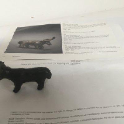 A Greek bronze Bull 6th Century BC cast with curly horns and dot eyes 6.5cm long Provenance Purchased at Bonhams 2010 for &pound;988 previously from a French Private collection sold with paperwork.