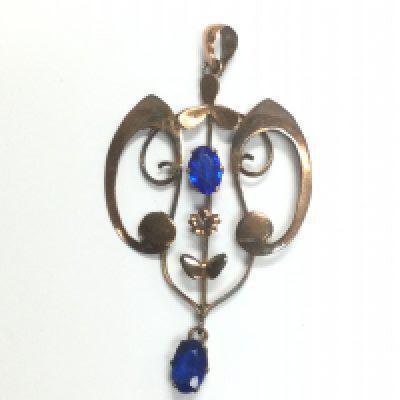An Art Nouveau pendant set with two blue stones. Shipping category A.