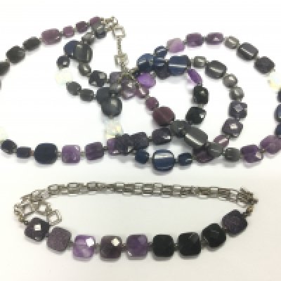 A Tateossian designer necklace and matching bracelet suspended on silver chains. Shipping category A.