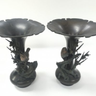 A pair of Japanese vases with raised relief of small birds sitting in on a branch. One vase has damage and relief come away. 22cm by 16cm