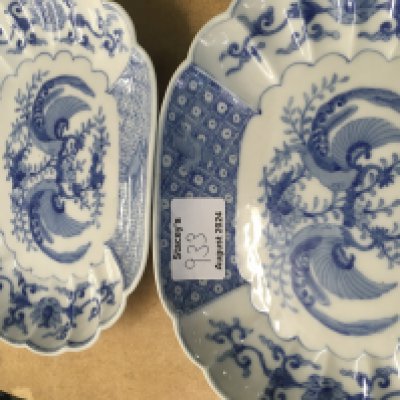 A small pair of Chinese blue and white dishes decorated with flowers foliage.