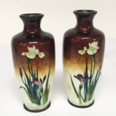 A pair of small Japanese cloisonn&eacute; vases decorated with flowers on a two tone ground height 12cm no obvious damage.