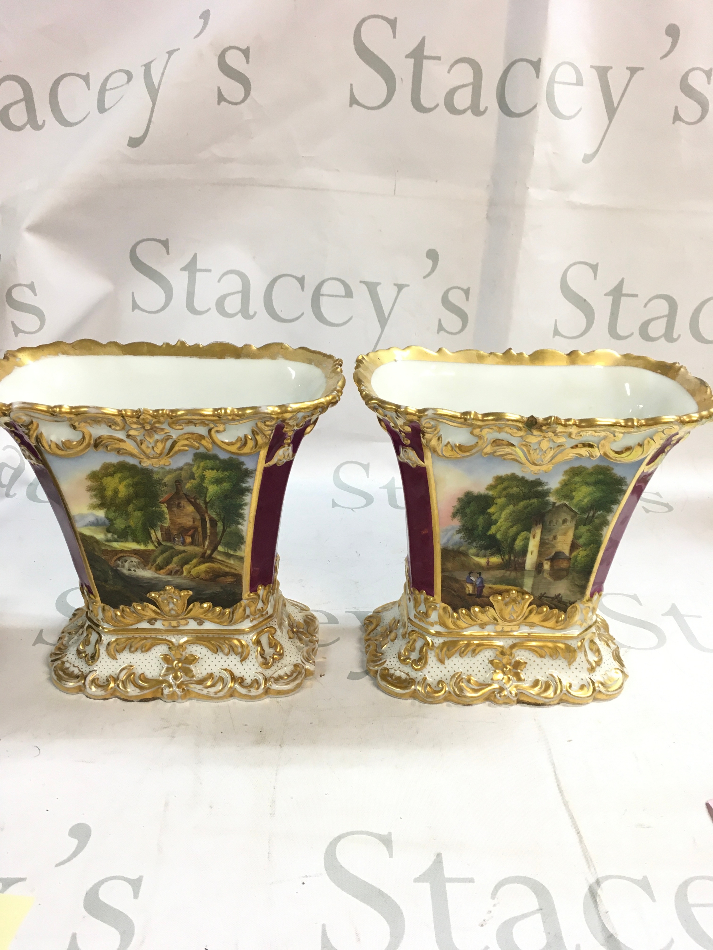 A pair of hand painted vases 