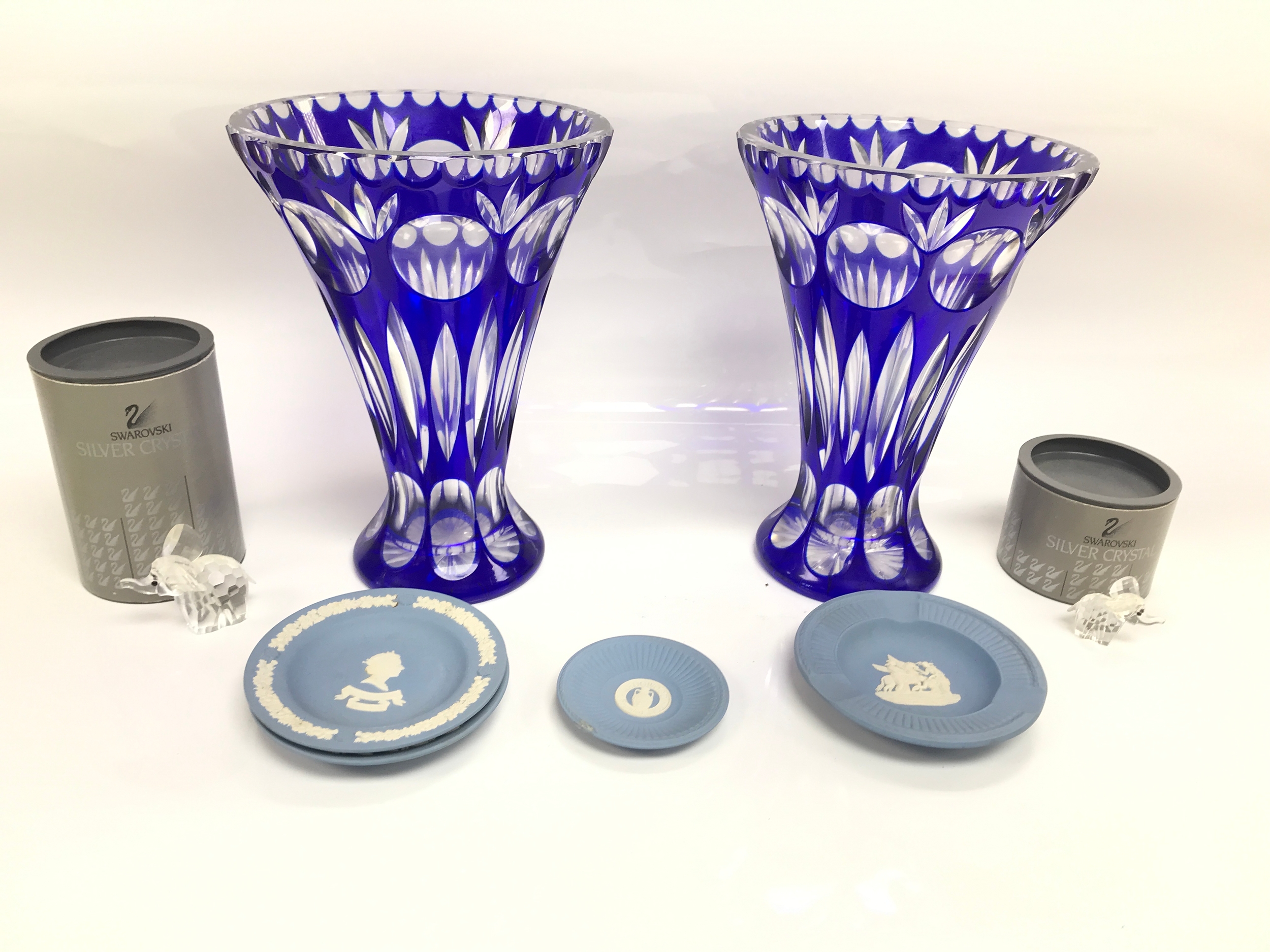 Pair of blue flash vases, variety of small wedgewood dishes and 2 Swarovski silver crystal figures.
