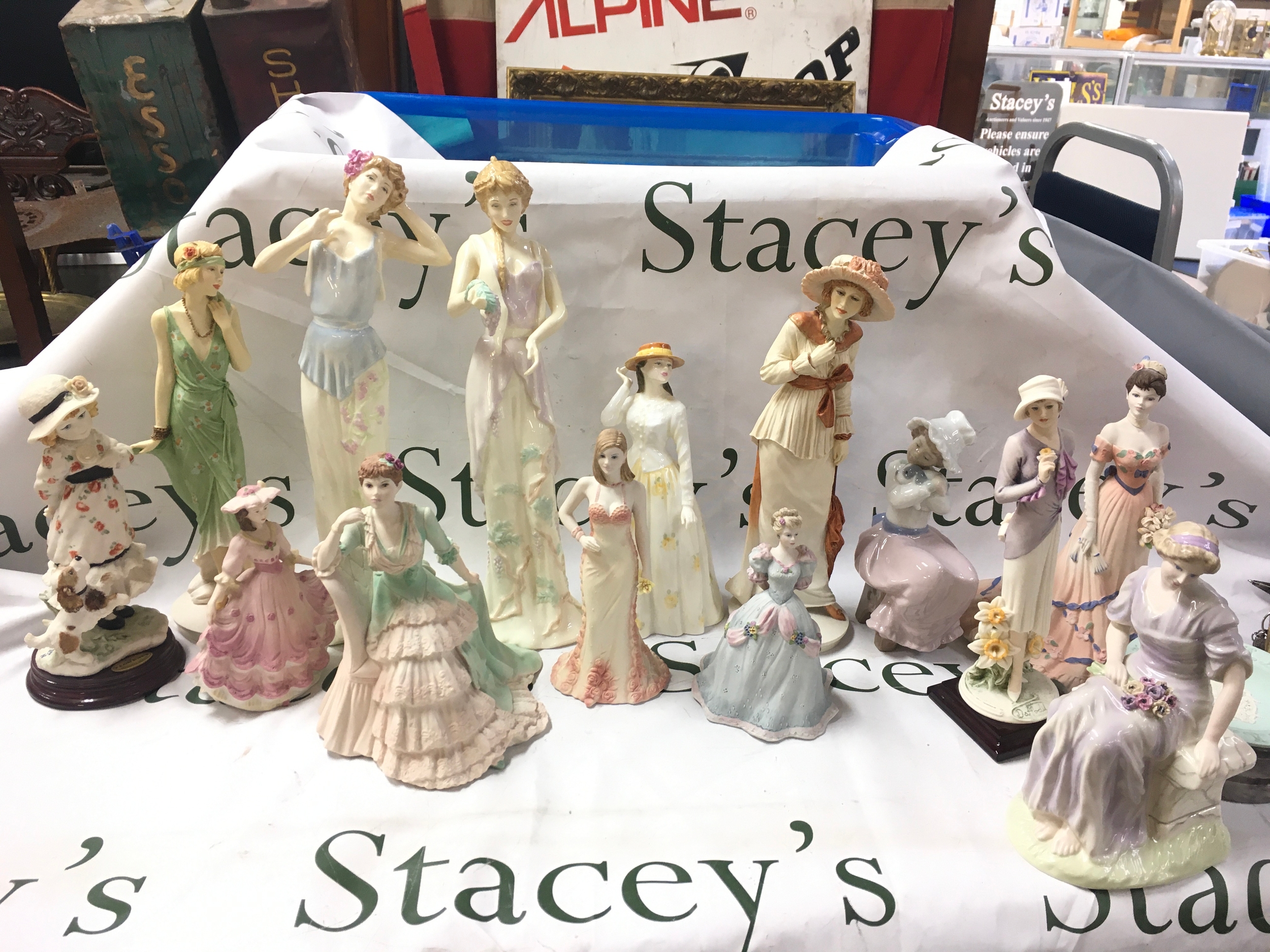 A collection of various figures including Wedgwood, Coalport, Florence, Royal Doulton