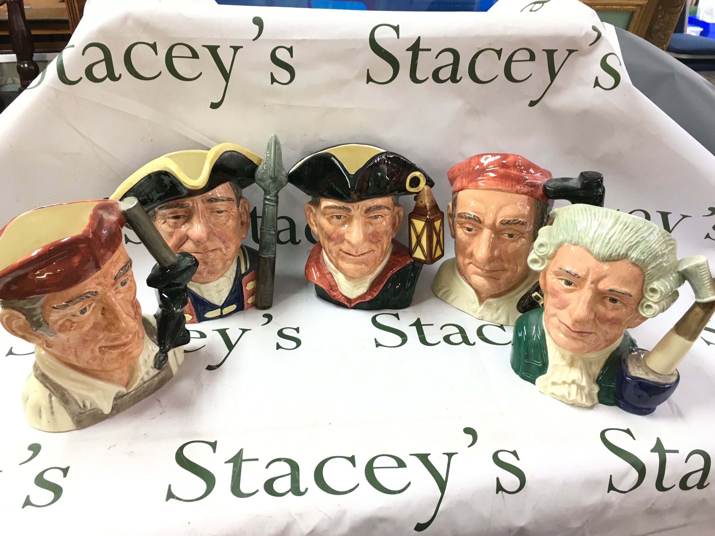 Royal Doulton character jugs from Williamsburg including Blacksmith D6571, Guardsman D6568, Night Watchman D6569, Bootmaker D6572, Apothecary D6567. No obvious damage or restoration