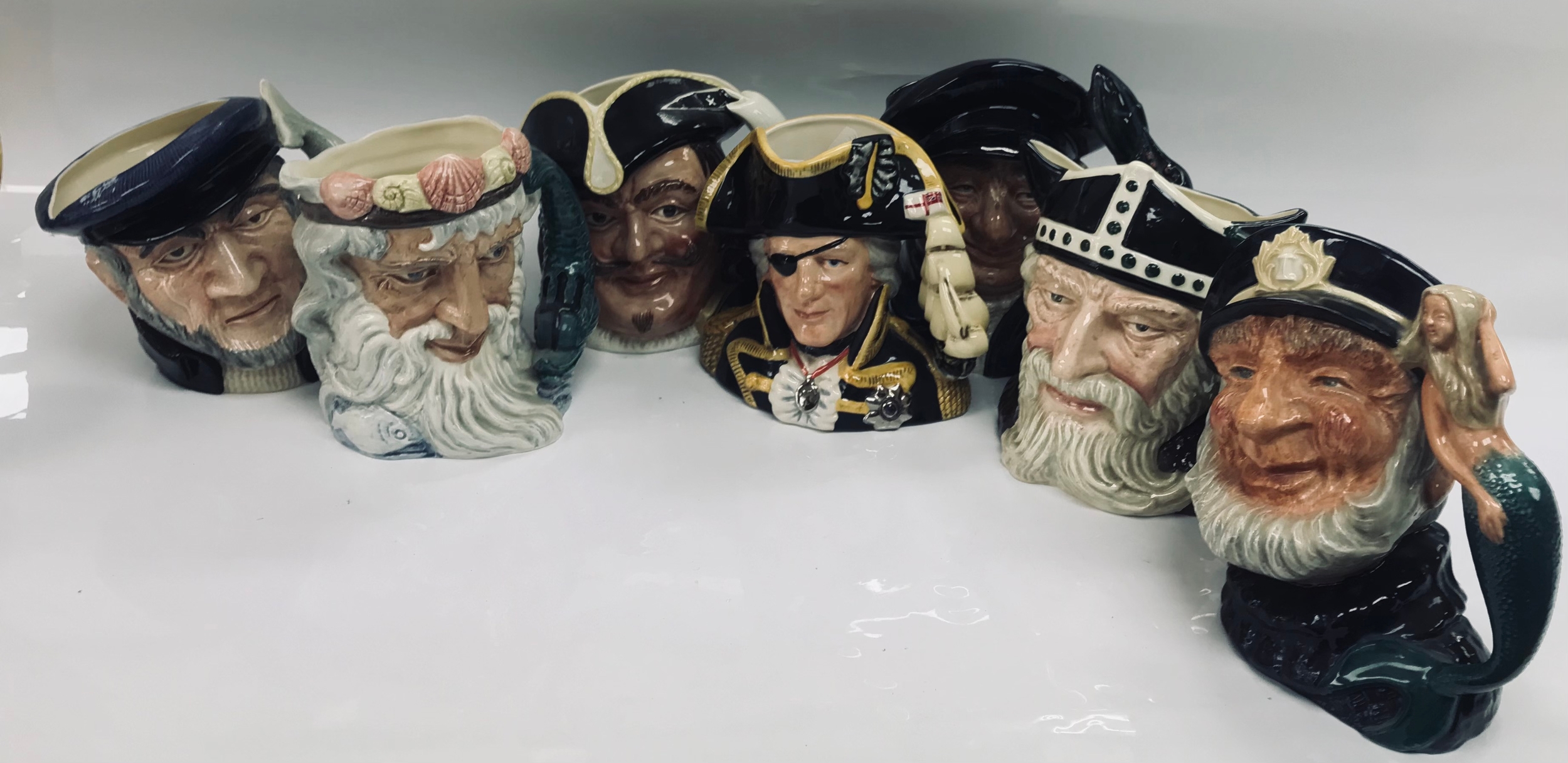 7 royal Doulton character jugs  .Capt Ahab D 6500 .Neptune D 6548 .Capt Henry Morgan D 6467 .Lobster Man D 6617 .Vice-Admiral Lord Nelson D 6932 .Old Salt D 6551 .Viking D 6496