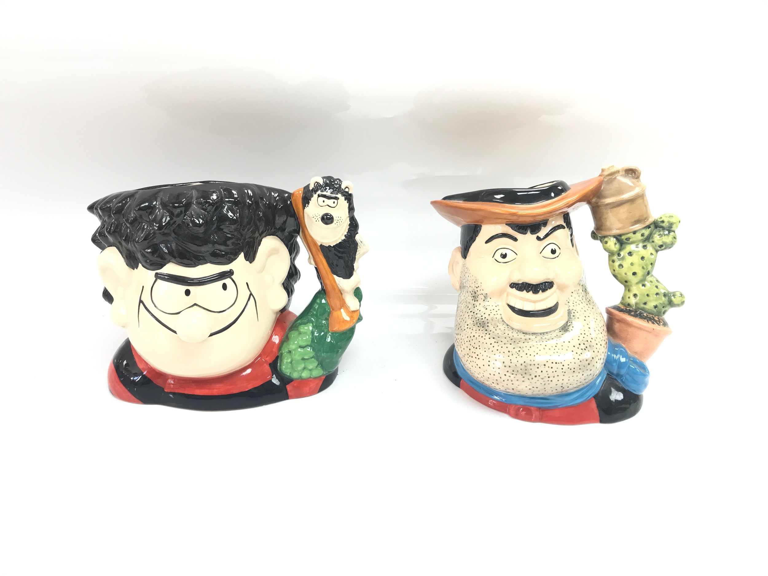 2 royal Doulton character jugs "comic series" .Dennis and Gnasher D 7005 .Desperate Dan D 7006