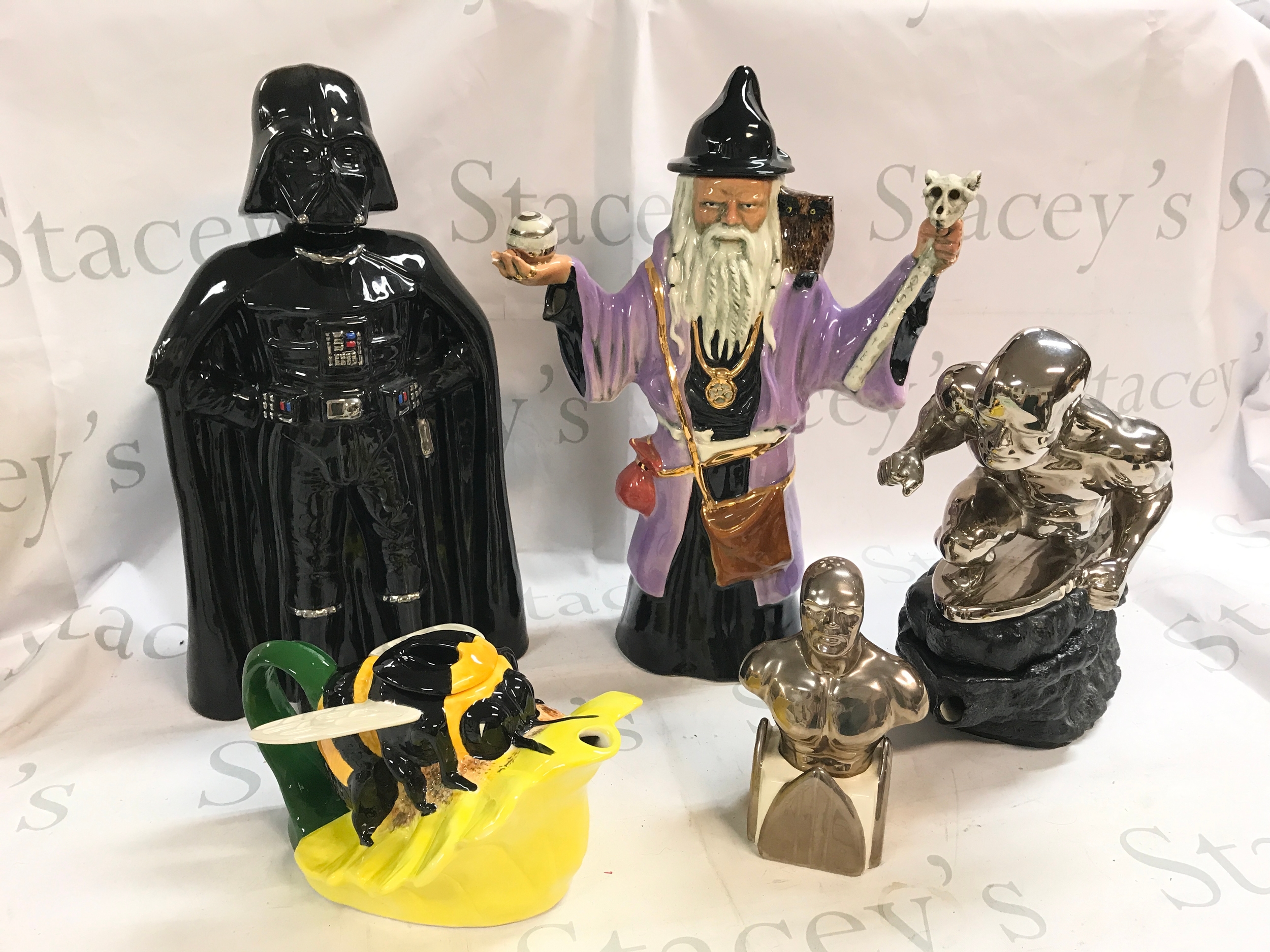 Four novelty ceramic tea pots including Darth Vader Invincible TT 63/99, Bee Teapot Gary Seymour 12/100, Silver Surfer teapot Gary Seymour 14/40, Gary Seymour silver surfer shaker, Gary Seymour dark wizard 58/75. 16 to 42cm tall