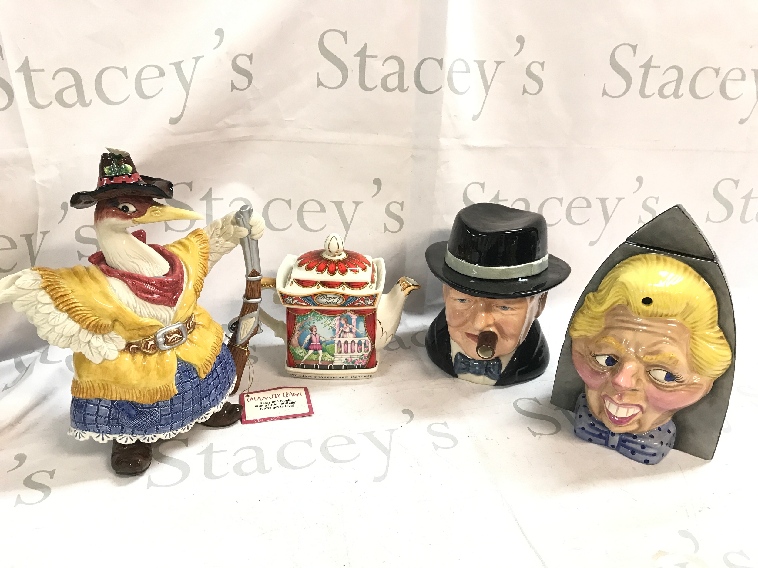 Four novelty ceramic tea pots including Calamity Crane Fitz and Floyd, Sadler Romeo and Juliet jug, Bairstow Manor Pottery Winston Churchill The Yalta Teaparty 282/750, 25th anniversary Britains first woman prime minister 1979-2004 The Iron Lady TT England 37/99