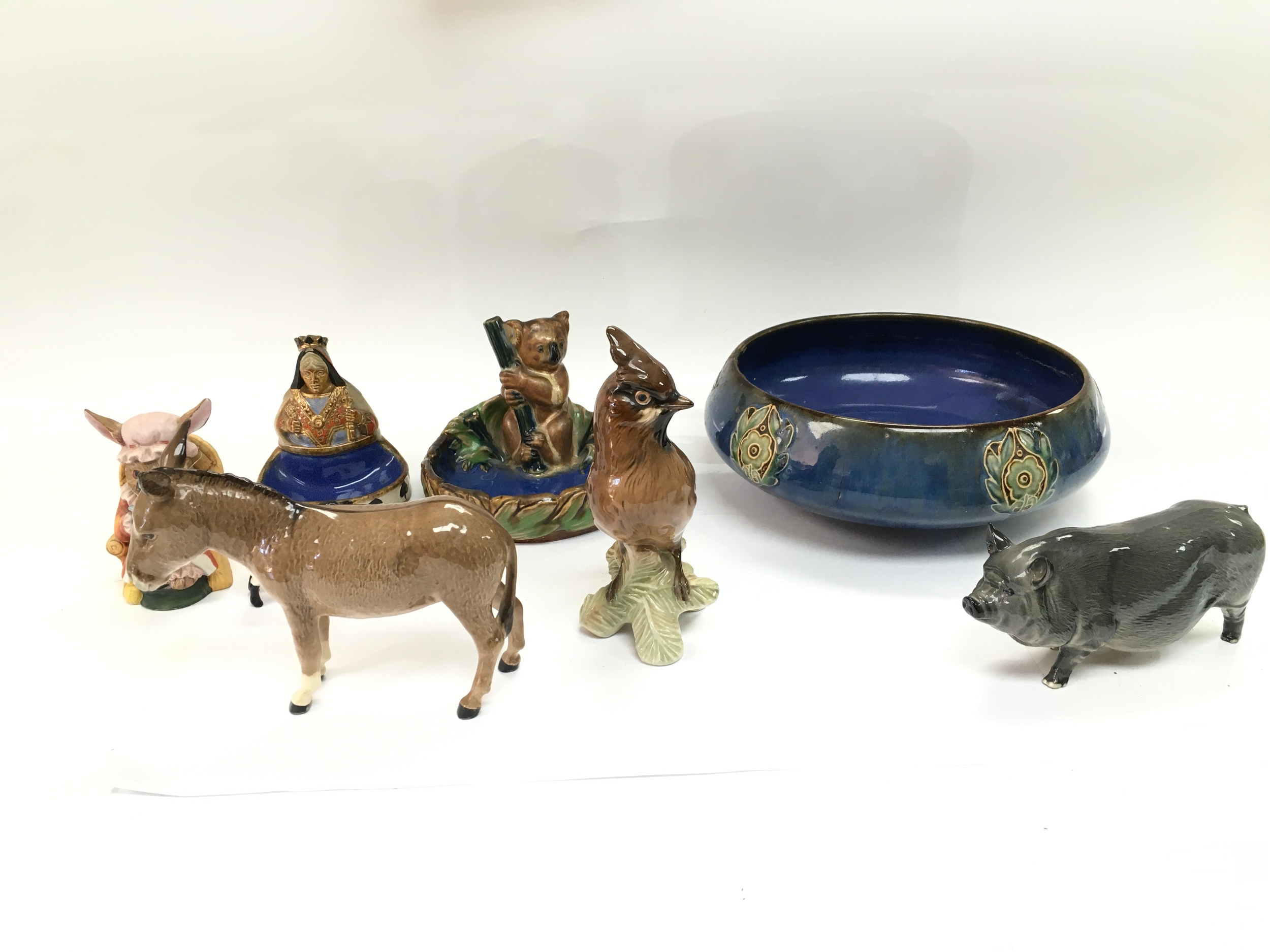 A collection of beswick and royal Doulton items. damage and repair notes to bowl.