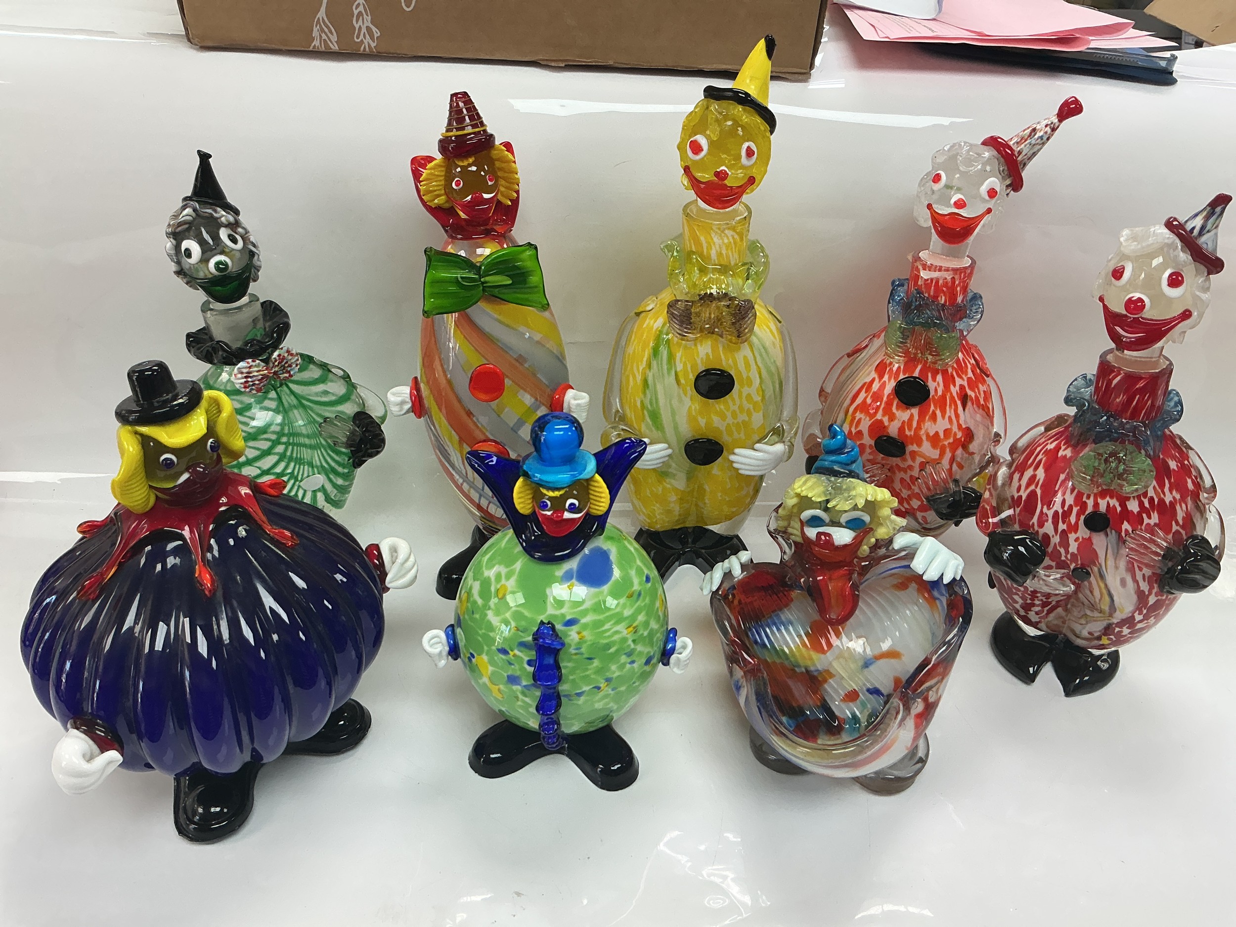 Eight Murano clown figures, decanters etc.