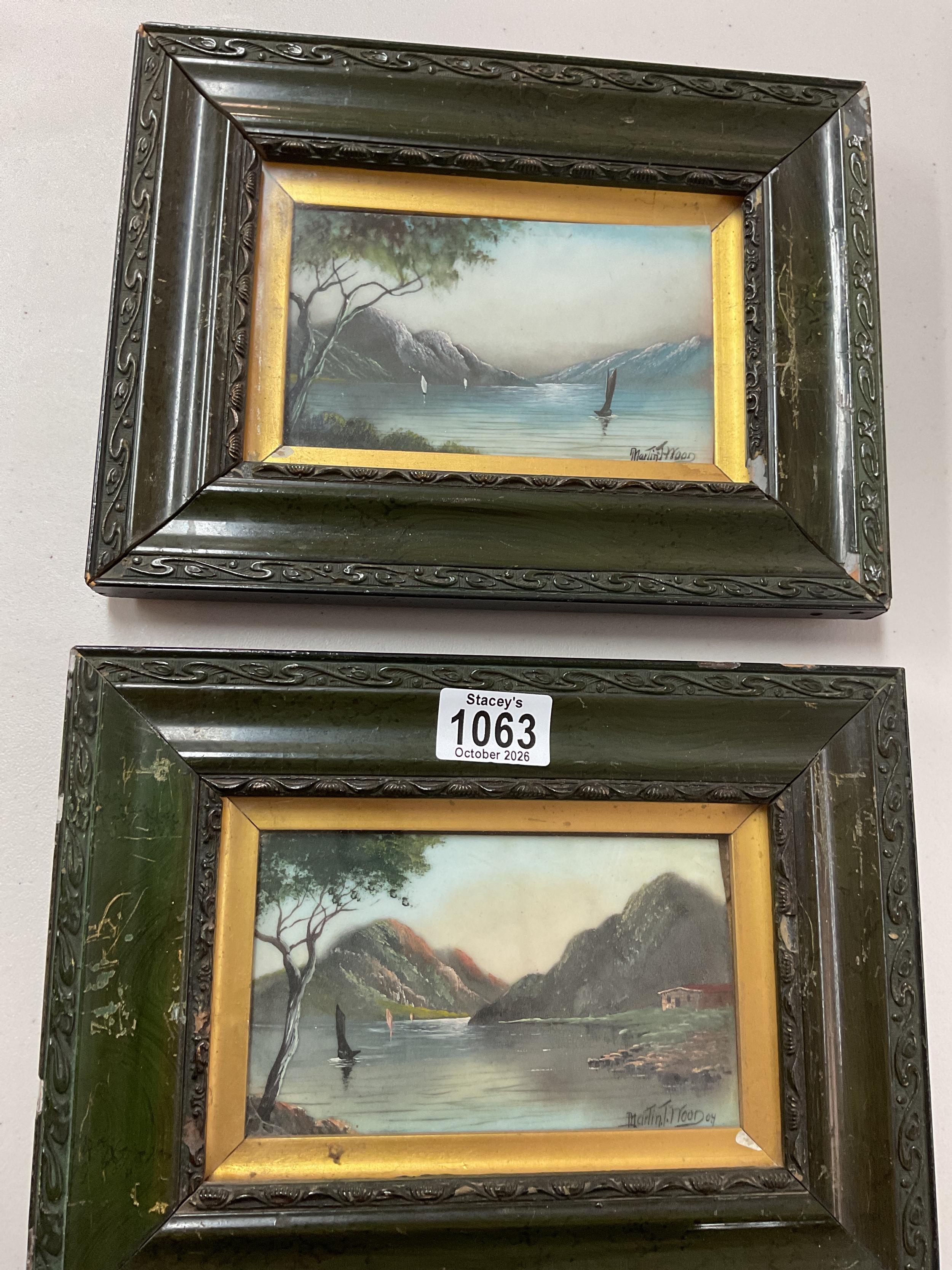 Two Edwardian framed painted porcelain plaques of coastal inlet scenes, signed lower right Martin T Wood 04.
