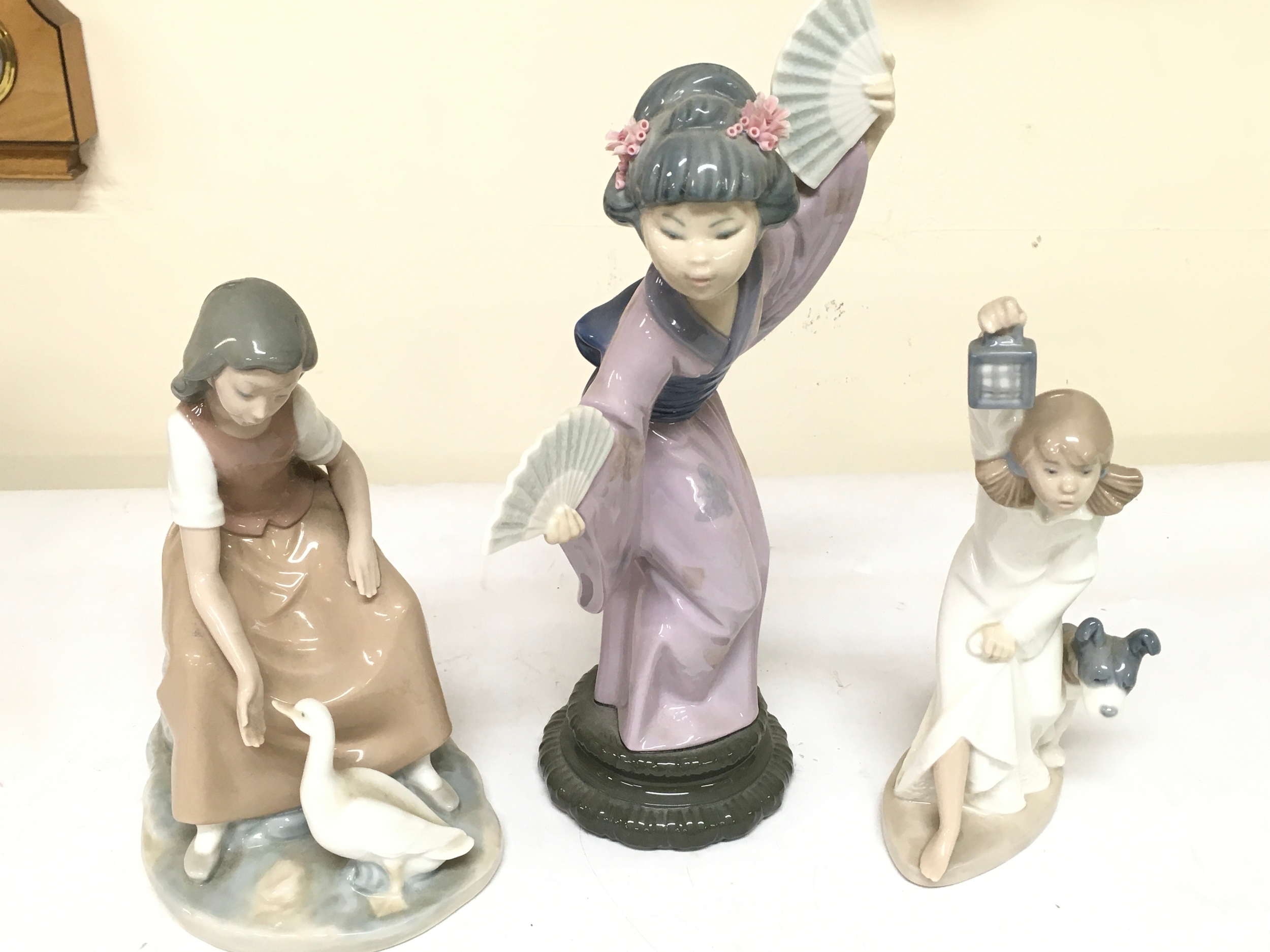 Lladro Madame Butterfly figure, Nao girl with geese and Nao girl with lantern and dog porcelain figures  . 22 to 30cm tall