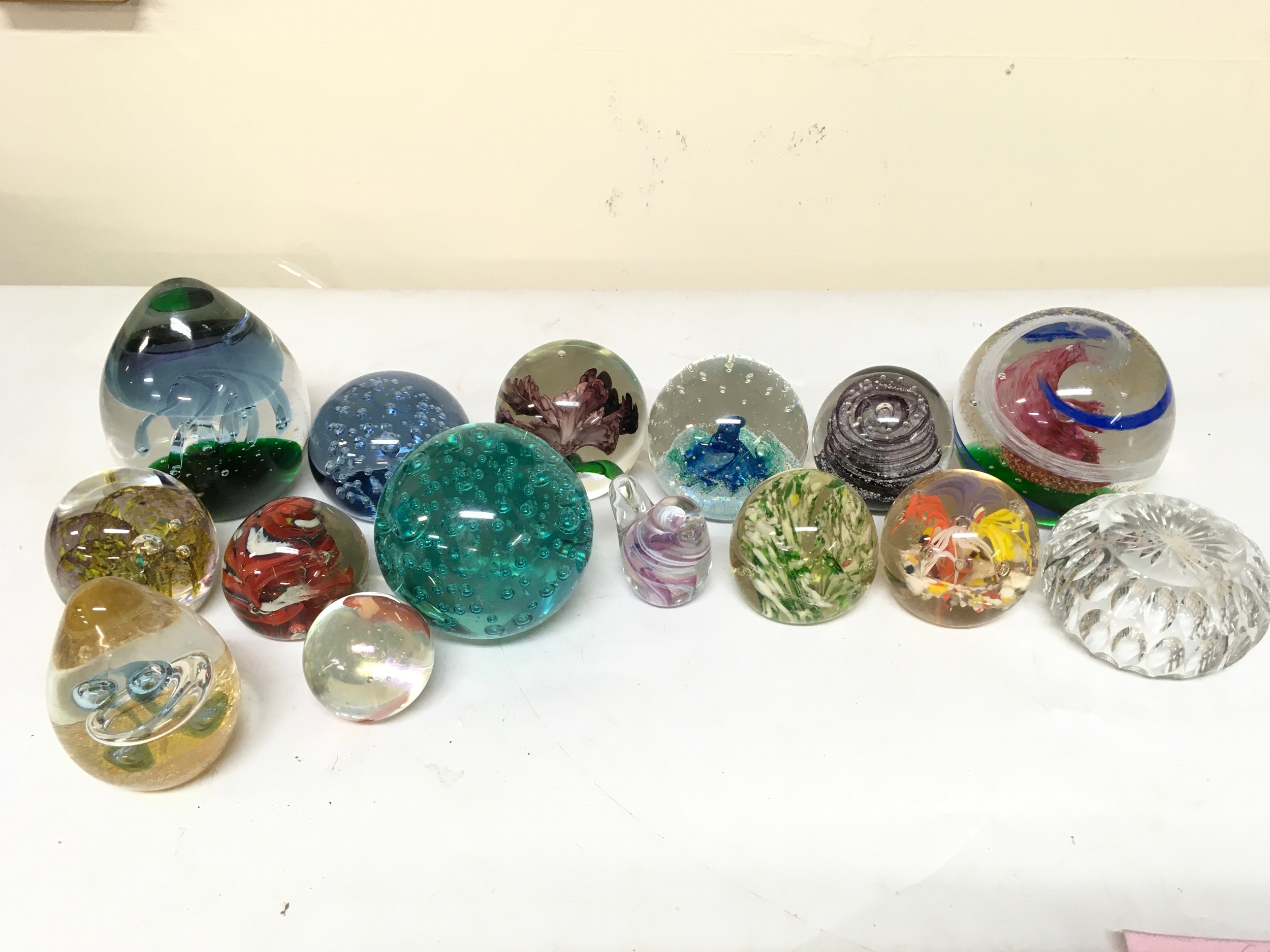 A quantity of paperweights 