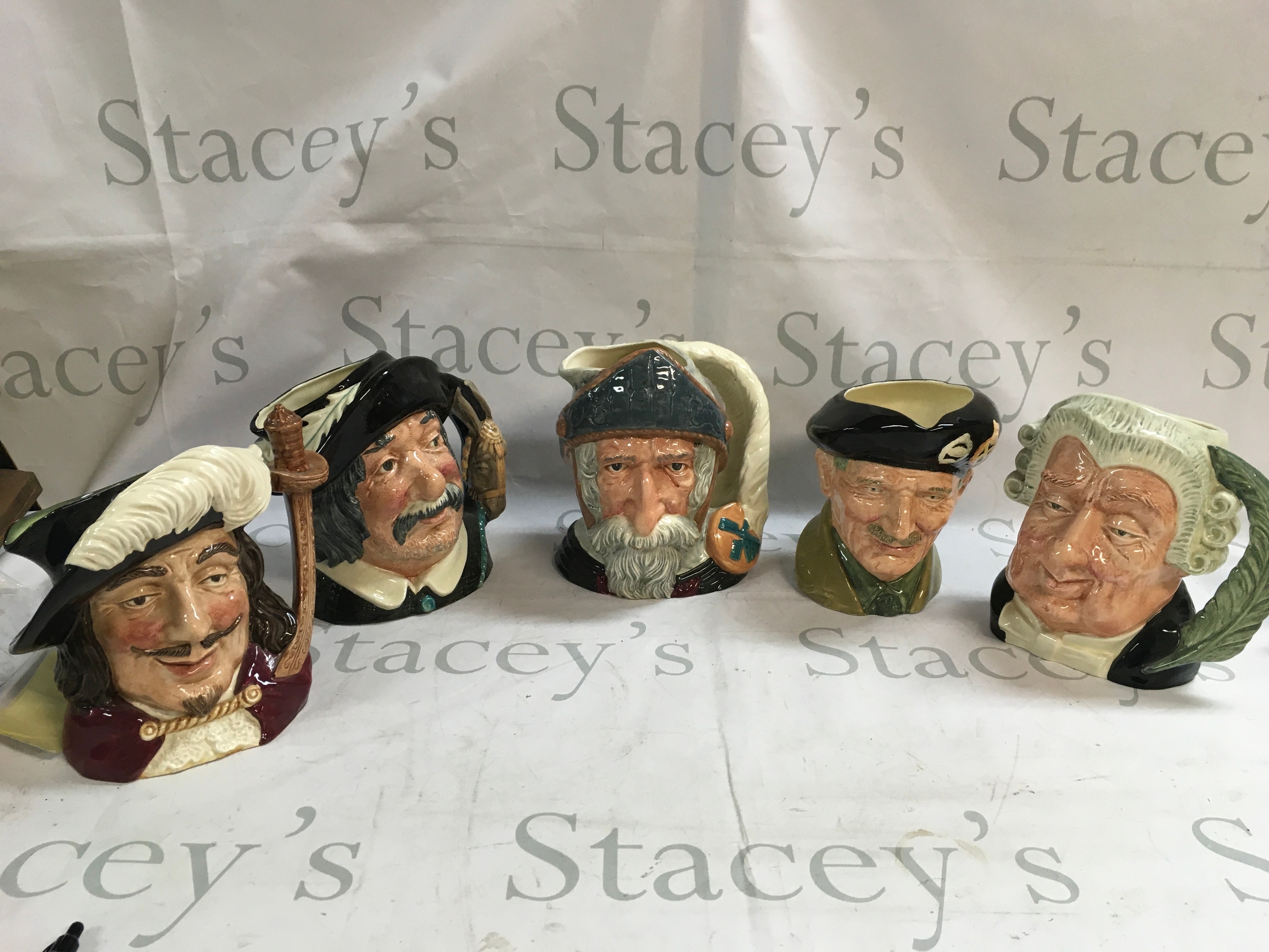 A collection of 5 character jugs including, Porthos, Don Quixote, Sancho Panca, Monty, The Lawyer. 