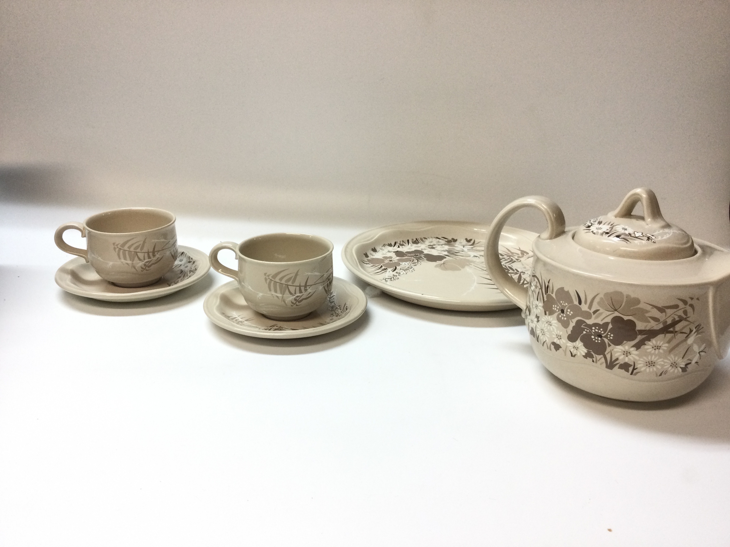 A small quantity of Poole "Mandalay" pattern, plates and cups. And a carnival iridescent bowl.