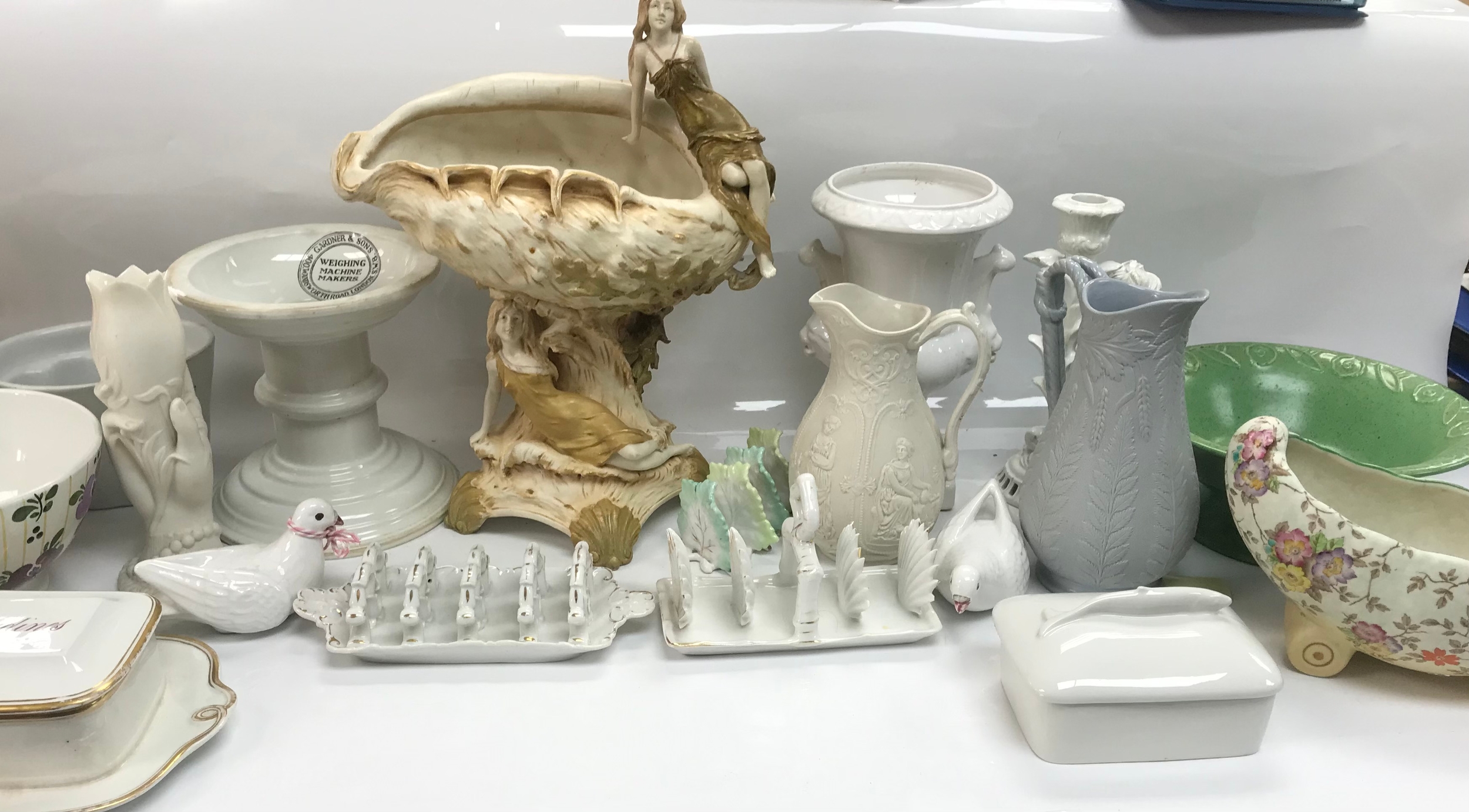 An art nouveau centrepiece alongside an assortment of antique/china