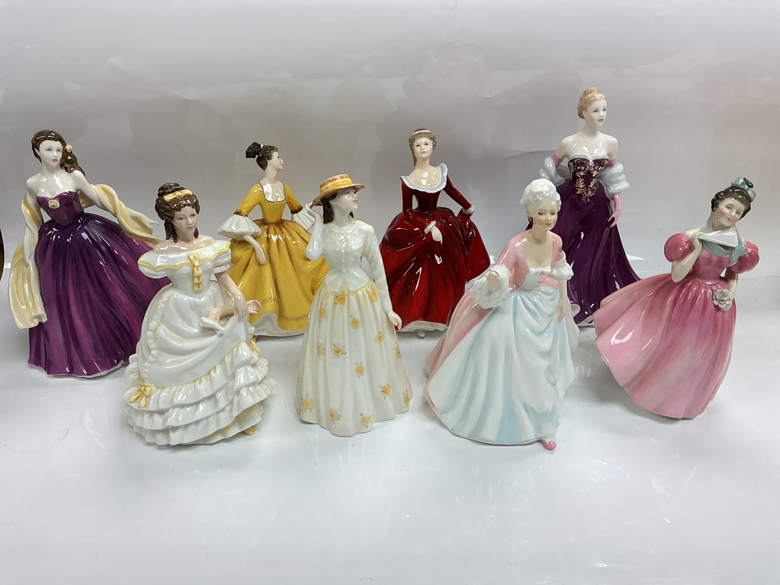 Eight Royal Doulton figures comprising Susannah, Diana, Camellia and others.