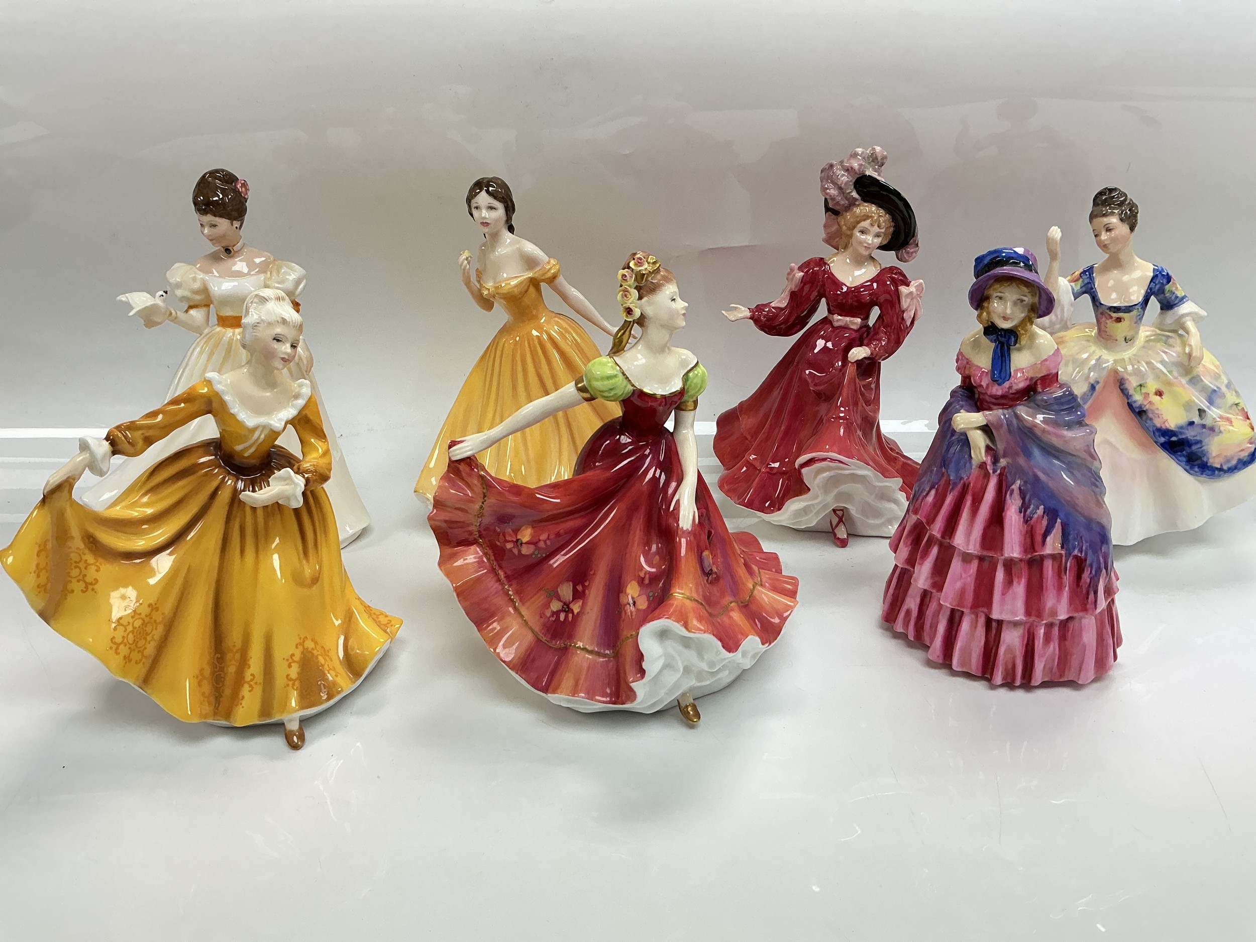 Seven Royal Doulton figures comprising A Victorian Lady HN7281, Kathleen, Patricia and others.