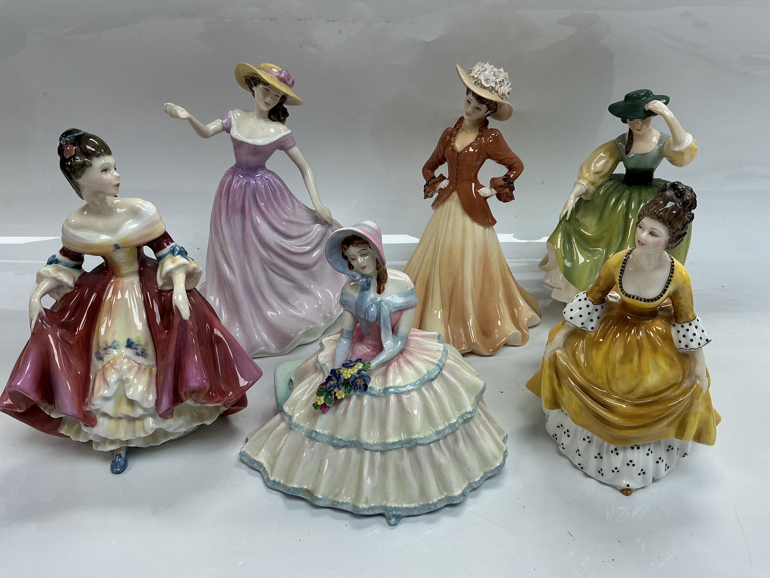 Six Royal Doulton and Coalport figures of ladies comprising Daydreams, Southern Belle, Beth and others.