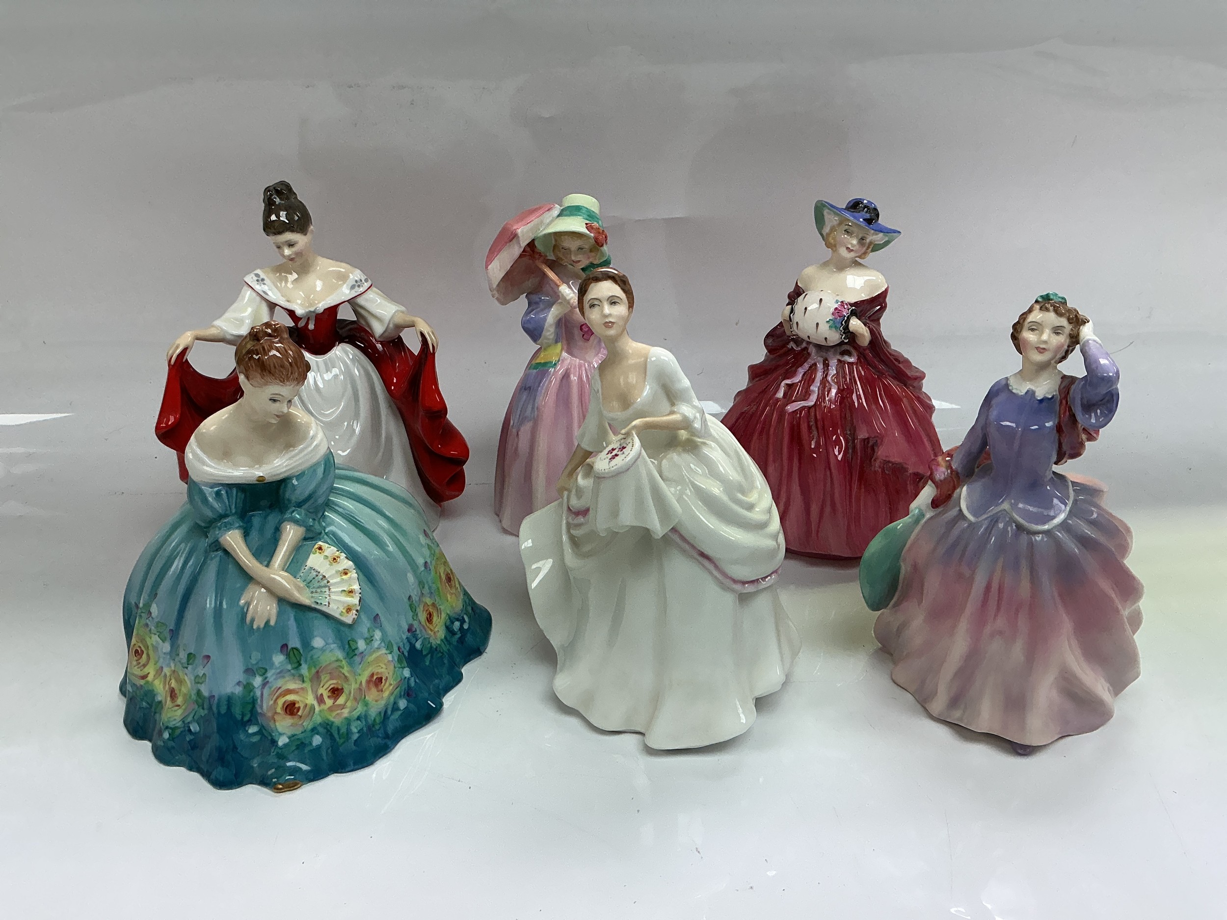 Six Royal Doulton figures comprising Blithe Morning, Genevieve, Victoria and others.